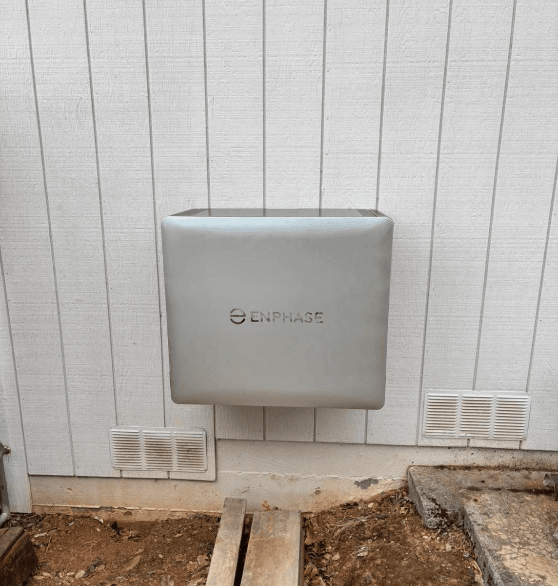 Enphase solar equipment mounted on an exterior wall